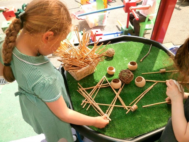 Creating sculptures using natural materials.
