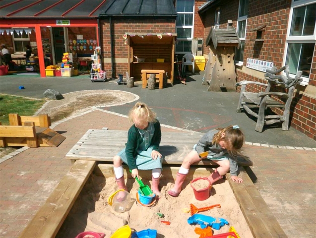 Having fun in the sand building sandcastles.